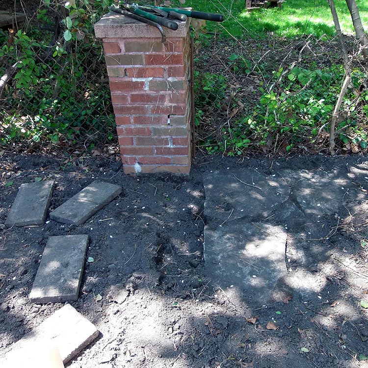 Stones, uncovered, along west fence